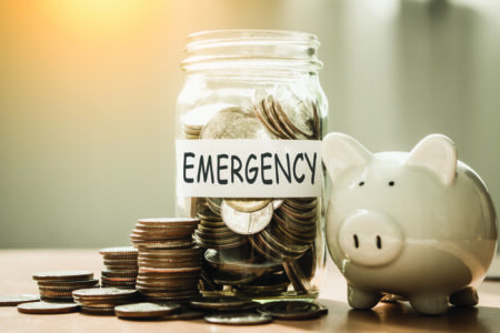 A lot coins in glass money with piggy bank for saving emergency money.Saving for emergency&hellip;